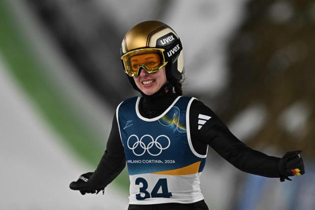 Germany's Juliane Seyfarth reacts after jumping during the 1st round of the women's large hill individual ski jumping of the Milano Cortina 2026 Winter Olympic Games at Predazzo Ski Jumping Stadium in Predazzo (Val di Fiemme), on February 15, 2026. (Photo by Javier SORIANO / AFP)