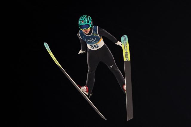 Japan's Yuki Ito jumps during the 1st round of the women's large hill individual ski jumping of the Milano Cortina 2026 Winter Olympic Games at Predazzo Ski Jumping Stadium in Predazzo (Val di Fiemme), on February 15, 2026. (Photo by Anne-Christine POUJOULAT / AFP)