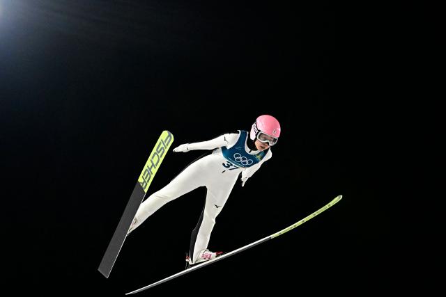 Japan's Yuka Seto jumps during the 1st round of the women's large hill individual ski jumping of the Milano Cortina 2026 Winter Olympic Games at Predazzo Ski Jumping Stadium in Predazzo (Val di Fiemme), on February 15, 2026. (Photo by Tobias SCHWARZ / AFP)