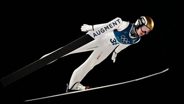 Austria's Julia Muehlbacher jumps during the 1st round of the women's large hill individual ski jumping of the Milano Cortina 2026 Winter Olympic Games at Predazzo Ski Jumping Stadium in Predazzo (Val di Fiemme), on February 15, 2026. (Photo by Tobias SCHWARZ / AFP)