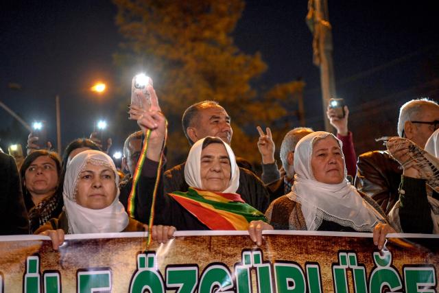 Members of the Kurdish community take part in a protest calling for the release of convicted Kurdistan Worker's Party (PKK) leader Abdullah Ocalan in Diyarbakir on February 15, 2026. Ocalan was captured by Turkish secret agents in Kenya in 1999, brought to Turkey and sentenced to death. His sentence was later commuted to life imprisonment. (Photo by Ilyas AKENGIN / AFP)