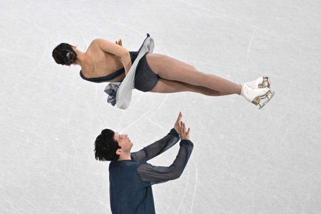 Australia's Anastasiia Golubeva and Australia's Hektor Giotopoulos Moore compete in the figure skating pair skating short program during the Milano Cortina 2026 Winter Olympic Games at Milano Ice Skating Arena in Milan on February 15, 2026. (Photo by Antonin THUILLIER / AFP)