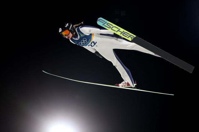 Czech Republic's Anezka Indrackova jumps during the final round of the women's large hill individual ski jumping of the Milano Cortina 2026 Winter Olympic Games at Predazzo Ski Jumping Stadium in Predazzo (Val di Fiemme), on February 15, 2026. (Photo by Anne-Christine POUJOULAT / AFP)