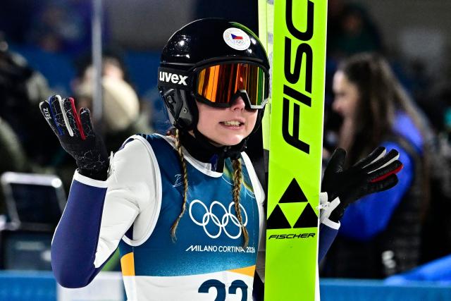 Czech Republic's Anezka Indrackova reacts after jumping during the final round of the women's large hill individual ski jumping of the Milano Cortina 2026 Winter Olympic Games at Predazzo Ski Jumping Stadium in Predazzo (Val di Fiemme), on February 15, 2026. (Photo by Tobias SCHWARZ / AFP)