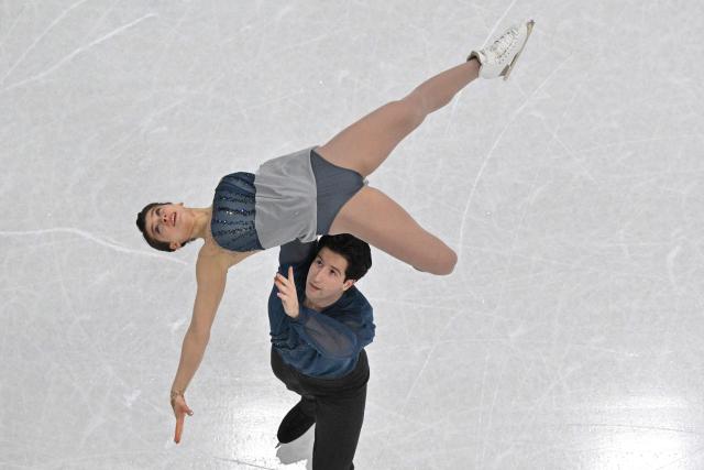 Australia's Anastasiia Golubeva and Australia's Hektor Giotopoulos Moore compete in the figure skating pair skating short program during the Milano Cortina 2026 Winter Olympic Games at Milano Ice Skating Arena in Milan on February 15, 2026. (Photo by Antonin THUILLIER / AFP)