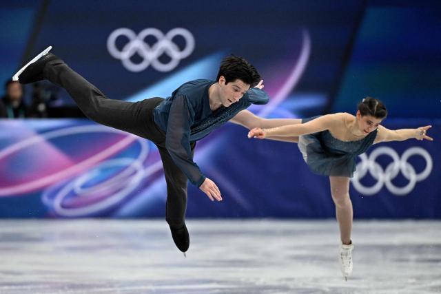 Australia's Anastasiia Golubeva and Australia's Hektor Giotopoulos Moore compete in the figure skating pair skating short program during the Milano Cortina 2026 Winter Olympic Games at Milano Ice Skating Arena in Milan on February 15, 2026. (Photo by Gabriel BOUYS / AFP)