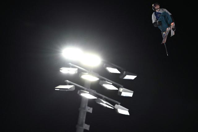 Switzerland's Nils Rhyner competes in the freestyle skiing men's freeski big air qualification run 1 during the Milano Cortina 2026 Winter Olympic Games at Livigno Snow Park - Big Air, in Livigno (Valtellina), on February 15, 2026. (Photo by Jeff PACHOUD / AFP)