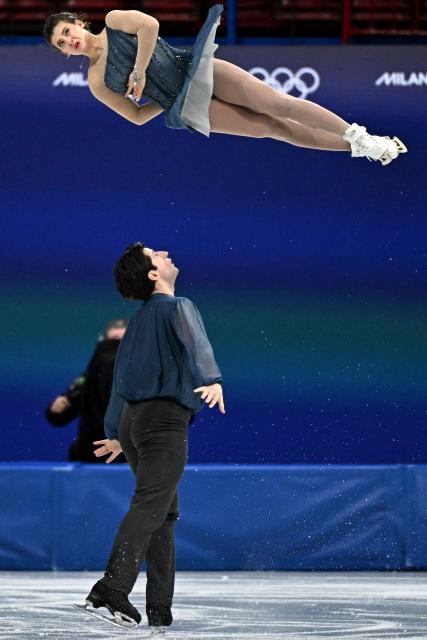 Australia's Anastasiia Golubeva and Australia's Hektor Giotopoulos Moore compete in the figure skating pair skating short program during the Milano Cortina 2026 Winter Olympic Games at Milano Ice Skating Arena in Milan on February 15, 2026. (Photo by Gabriel BOUYS / AFP)