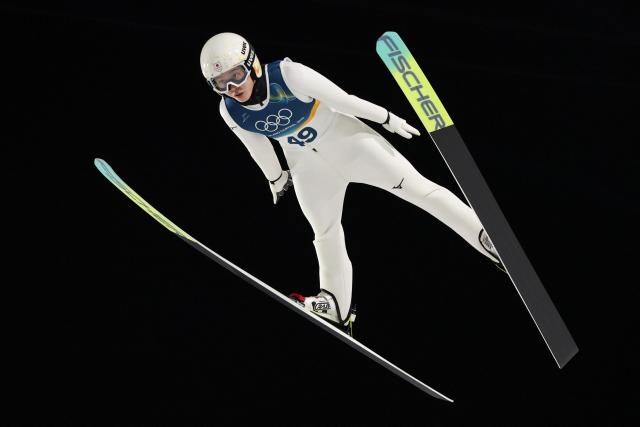 Japan's Nozomi Maruyama jumps during the final round of the women's large hill individual ski jumping of the Milano Cortina 2026 Winter Olympic Games at Predazzo Ski Jumping Stadium in Predazzo (Val di Fiemme), on February 15, 2026. (Photo by Anne-Christine POUJOULAT / AFP)