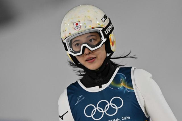 Japan's Nozomi Maruyama reacts after jumping during the final round of the women's large hill individual ski jumping of the Milano Cortina 2026 Winter Olympic Games at Predazzo Ski Jumping Stadium in Predazzo (Val di Fiemme), on February 15, 2026. (Photo by Javier SORIANO / AFP)