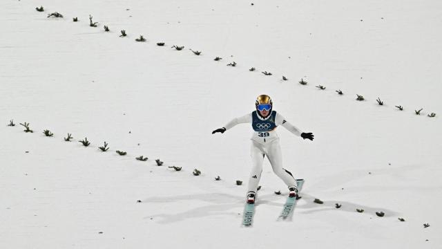Norway's Eirin Maria Kvandal lands after jumping to win silver during the final round of the women's large hill individual ski jumping of the Milano Cortina 2026 Winter Olympic Games at Predazzo Ski Jumping Stadium in Predazzo (Val di Fiemme), on February 15, 2026. (Photo by Javier SORIANO / AFP)