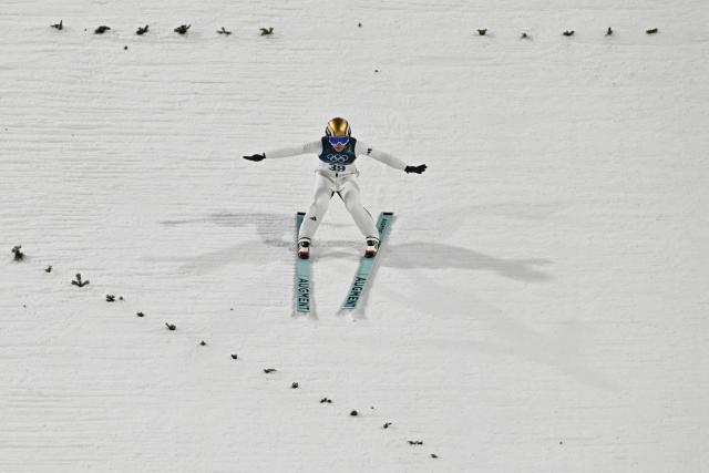 Norway's Eirin Maria Kvandal lands after jumping to win silver during the final round of the women's large hill individual ski jumping of the Milano Cortina 2026 Winter Olympic Games at Predazzo Ski Jumping Stadium in Predazzo (Val di Fiemme), on February 15, 2026. (Photo by Javier SORIANO / AFP)