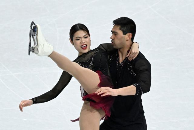 USA's Emily Chan and USA's Spencer Akira Howe compete in the figure skating pair skating short program during the Milano Cortina 2026 Winter Olympic Games at Milano Ice Skating Arena in Milan on February 15, 2026. (Photo by WANG Zhao / AFP)
