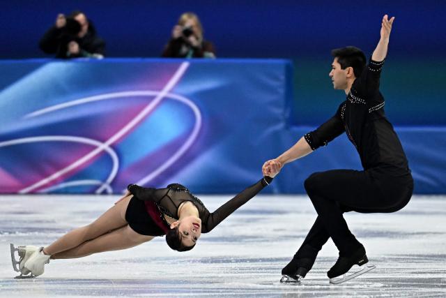 USA's Emily Chan and USA's Spencer Akira Howe compete in the figure skating pair skating short program during the Milano Cortina 2026 Winter Olympic Games at Milano Ice Skating Arena in Milan on February 15, 2026. (Photo by Gabriel BOUYS / AFP)