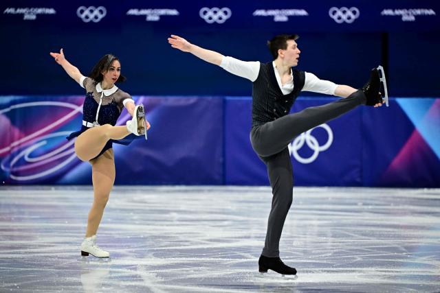 France's Pavel Kovalev and France's Camille Kovalev compete in the figure skating pair skating short program during the Milano Cortina 2026 Winter Olympic Games at Milano Ice Skating Arena in Milan on February 15, 2026. (Photo by JULIEN DE ROSA / AFP)