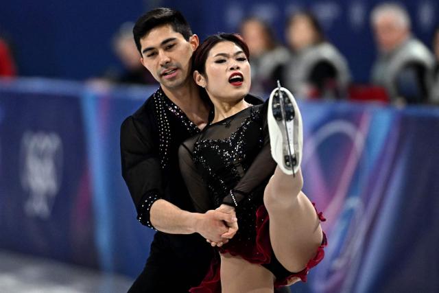USA's Emily Chan and USA's Spencer Akira Howe compete in the figure skating pair skating short program during the Milano Cortina 2026 Winter Olympic Games at Milano Ice Skating Arena in Milan on February 15, 2026. (Photo by Gabriel BOUYS / AFP)