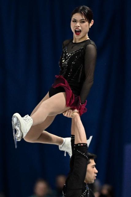 USA's Emily Chan and USA's Spencer Akira Howe compete in the figure skating pair skating short program during the Milano Cortina 2026 Winter Olympic Games at Milano Ice Skating Arena in Milan on February 15, 2026. (Photo by Gabriel BOUYS / AFP)