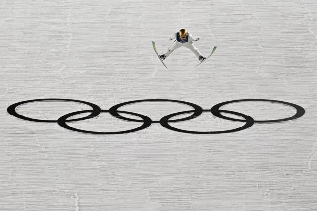 Norway's Anna Odine Stroem jumps to win gold during the final round of the women's large hill individual ski jumping of the Milano Cortina 2026 Winter Olympic Games at Predazzo Ski Jumping Stadium in Predazzo (Val di Fiemme), on February 15, 2026. (Photo by Javier SORIANO / AFP)