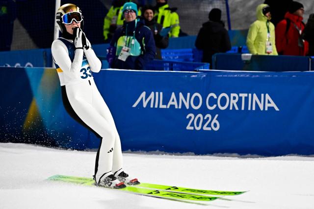 Norway's Silje Opseth reacts after jumping during the final round of the women's large hill individual ski jumping of the Milano Cortina 2026 Winter Olympic Games at Predazzo Ski Jumping Stadium in Predazzo (Val di Fiemme), on February 15, 2026. (Photo by Tobias SCHWARZ / AFP)