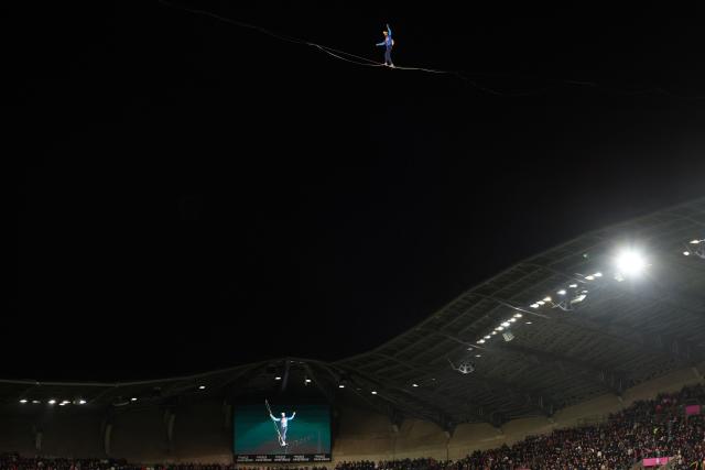 A tightrope walker brings the ball before the French Top14 rugby union match between Stade Francais Paris and Stade Toulousain Rugby (Toulouse) at the Jean-Bouin Stadium in Paris on February 15, 2026. (Photo by Alain JOCARD / AFP)