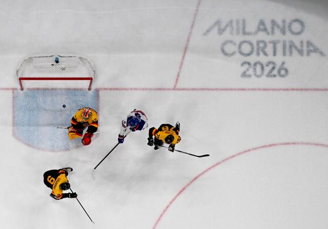 USA's #09 Jack Eichel (2R) vies for the puck with Germany's #37 Maximilian Franzreb (l9 and team mates during the men's preliminary round Group C Ice Hockey match between USA and Germany at the Milano Santagiulia Ice Hockey Arena during the Milano Cortina 2026 Winter Olympic Games in Milan, on February 15, 2026. (Photo by Alexander NEMENOV / AFP)