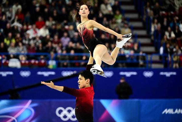 Japan's Riku Miura and Japan's Ryuichi Kihara compete in the figure skating pair skating short program during the Milano Cortina 2026 Winter Olympic Games at Milano Ice Skating Arena in Milan on February 15, 2026. (Photo by JULIEN DE ROSA / AFP)