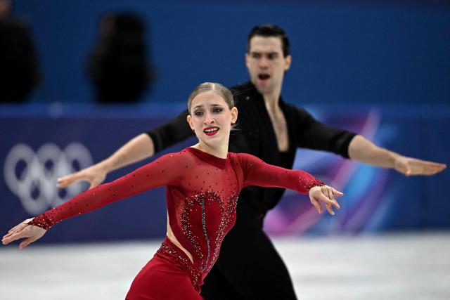 Germany's Minerva Fabienne Hase and Germany's Nikita Volodin compete in the figure skating pair skating short program during the Milano Cortina 2026 Winter Olympic Games at Milano Ice Skating Arena in Milan on February 15, 2026. (Photo by Gabriel BOUYS / AFP)