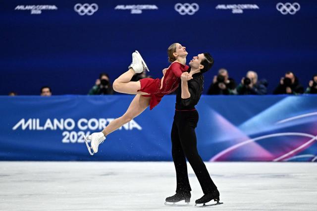 Germany's Minerva Fabienne Hase and Germany's Nikita Volodin compete in the figure skating pair skating short program during the Milano Cortina 2026 Winter Olympic Games at Milano Ice Skating Arena in Milan on February 15, 2026. (Photo by Gabriel BOUYS / AFP)