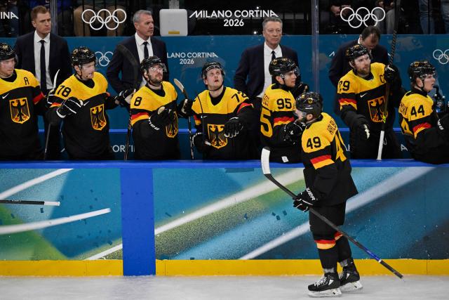 Germany's #49 Lukas Kalble and team mates celebrate the 5-1 goal by Germany's #18 Tim Stutzle during the men's preliminary round Group C Ice Hockey match between USA and Germany at the Milano Santagiulia Ice Hockey Arena during the Milano Cortina 2026 Winter Olympic Games in Milan, on February 15, 2026. (Photo by Alexander NEMENOV / AFP)