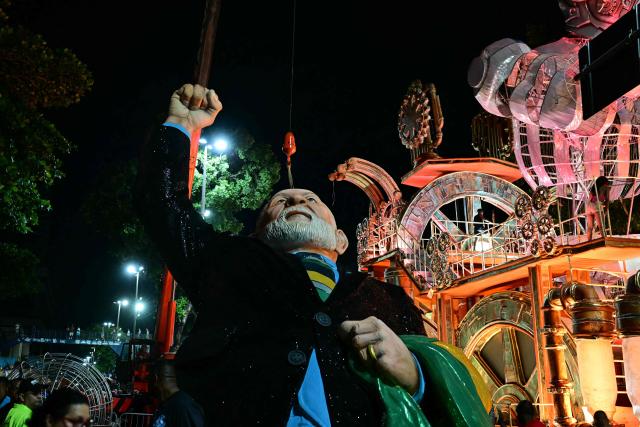 A float depicting Brazil's president Luiz Inacio Lula da Silva of the Academicos de Niteroi samba school is seen before the opening night of the Rio Carnival at the Marques de Sapucai Sambadrome in Rio de Janeiro, Brazil, on February 15, 2026. (Photo by Pablo PORCIUNCULA / AFP)