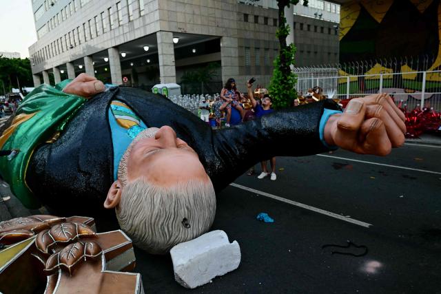 A float depicting Brazil's president Luiz Inacio Lula da Silva of the Academicos de Niteroi samba school is seen before the opening night of the Rio Carnival at the Marques de Sapucai Sambadrome in Rio de Janeiro, Brazil, on February 15, 2026. (Photo by Pablo PORCIUNCULA / AFP)