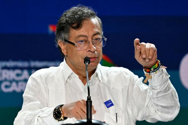 (FILES) Colombia's President Gustavo Petro speaks during the inauguration of the Latin America and the Caribbean International Economic Forum at the Panama Convention Center in Panama City on January 28, 2026. Colombian President Gustavo Petro called on February 15, 2026, for a demonstration next February 19 to protest against the suspension of this year's 24% minimum wage increase, the largest in a century and the target of criticism from business leaders and opponents. (Photo by Martin BERNETTI / AFP)