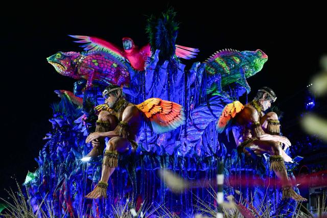 This view shows the Imperatriz Leopoldinense samba school during the opening night of the Rio Carnival at the Marques de Sapucai Sambadrome in Rio de Janeiro, Brazil, on February 16, 2026. (Photo by Pablo PORCIUNCULA / AFP)