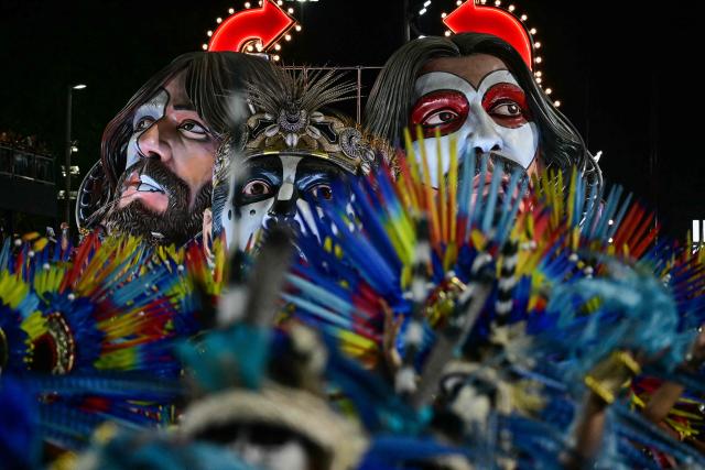 This view shows the Imperatriz Leopoldinense samba school during the opening night of the Rio Carnival at the Marques de Sapucai Sambadrome in Rio de Janeiro, Brazil, on February 16, 2026. (Photo by Pablo PORCIUNCULA / AFP)