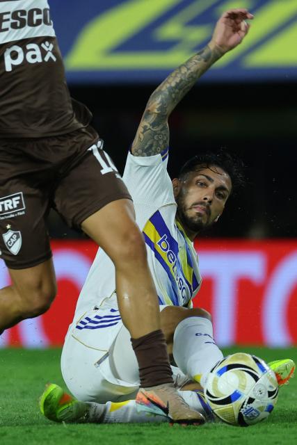 Boca Juniors' midfielder #05 Leandro Paredes (R) vies for the ball with Platense's midfielder #10 Franco Zapiola during the Argentine Professional Football League 2026 Apertura Tournament match between Boca Juniors and Platense at La Bombonera Stadium in Buenos Aires on February 15, 2026. (Photo by ALEJANDRO PAGNI / AFP)
