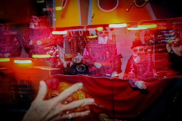 Krewe of Bacchus rolls down St. Charles Avenue during Mardi Gras festivities in New Orleans, Louisiana, on February 15, 2026. (Photo by Sandy HUFFAKER / AFP)