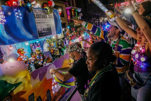 Krewe of Bacchus rolls down St. Charles Avenue during Mardi Gras festivities in New Orleans, Louisiana, on February 15, 2026. (Photo by Sandy HUFFAKER / AFP)