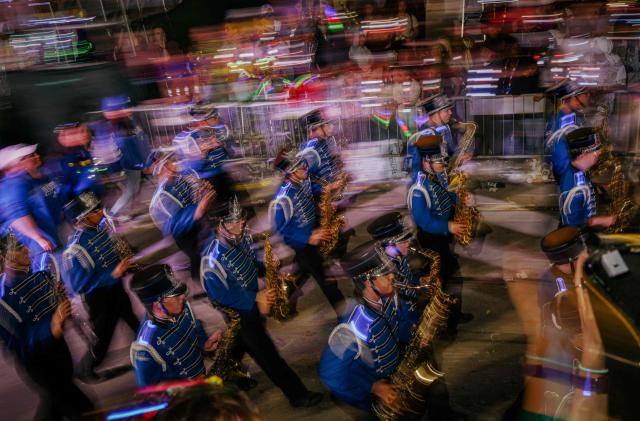 Krewe of Bacchus rolls down St. Charles Avenue during Mardi Gras festivities in New Orleans, Louisiana, on February 15, 2026. (Photo by Sandy HUFFAKER / AFP)