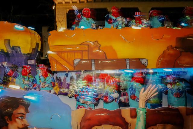 Krewe of Bacchus rolls down St. Charles Avenue during Mardi Gras festivities in New Orleans, Louisiana, on February 15, 2026. (Photo by Sandy HUFFAKER / AFP)
