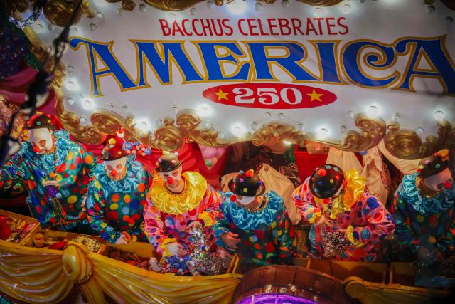 Krewe of Bacchus rolls down St. Charles Avenue during Mardi Gras festivities in New Orleans, Louisiana, on February 15, 2026. (Photo by Sandy HUFFAKER / AFP)