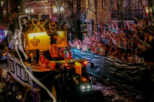 Former New Orleans Saints quarterback Drew Brees grand marshalls the Krewe of Bacchus as it rolls down St. Charles Avenue during Mardi Gras festivities in New Orleans, Louisiana, on February 15, 2026. (Photo by Sandy HUFFAKER / AFP)