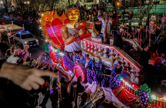 Krewe of Bacchus rolls down St. Charles Avenue during Mardi Gras festivities in New Orleans, Louisiana, on February 15, 2026. (Photo by Sandy HUFFAKER / AFP)