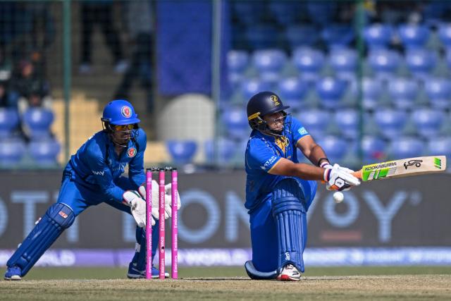 UAE's Alishan Sharafu (R) plays a shot during the 2026 ICC Men's T20 Cricket World Cup group stage match between Afghanistan and United Arab Emirates at the Arun Jaitley Stadium in New Delhi on February 16, 2026. (Photo by Arun SANKAR / AFP)