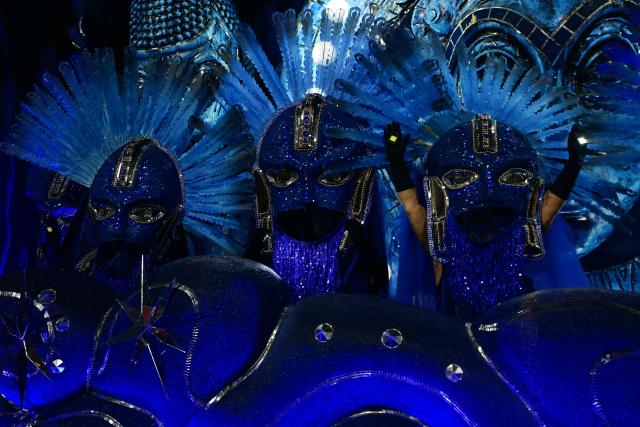 Revellers of the Portela samba school perform during the opening night of the Rio Carnival at the Marques de Sapucai Sambadrome in Rio de Janeiro, Brazil, on February 16, 2026. (Photo by Pablo PORCIUNCULA / AFP)