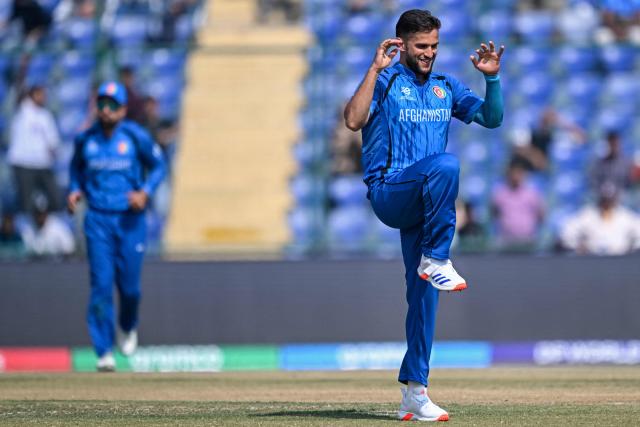 Afghanistan's Azmatullah Omarzai celebrates after taking the wicket of UAE's Haider Shah during the 2026 ICC Men's T20 Cricket World Cup group stage match between Afghanistan and United Arab Emirates at the Arun Jaitley Stadium in New Delhi on February 16, 2026. (Photo by Arun SANKAR / AFP)