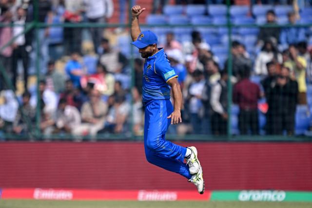 UAE's Sohaib Khan celebrates after taking a catch to dismiss Afghanistan's Rahmanullah Gurbaz during the 2026 ICC Men's T20 Cricket World Cup group stage match between Afghanistan and United Arab Emirates at the Arun Jaitley Stadium in New Delhi on February 16, 2026. (Photo by Arun SANKAR / AFP)