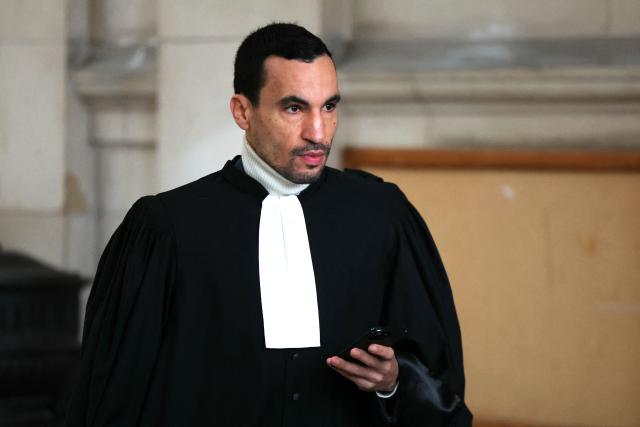 French lawyer of French rapper Nabil Boukhobza aka Naps, Nabil Boudi arrives to attend Naps' trial for sexual assault at the Palais de Justice of Paris, on February 16, 2026. The trial of French rapper Naps, accused of raping a young woman in her sleep in a hotel in 2021, opens on February 16, 2026 before the Paris Criminal Court. Known for his hit song “La Kiffance,” the 40-year-old Marseille native, whose name is Nabil Boukhobza, was also indicted in July 2024 in the Var region for rape and sexual assault following complaints from three young women, charges he also denies. (Photo by Thomas SAMSON / AFP)