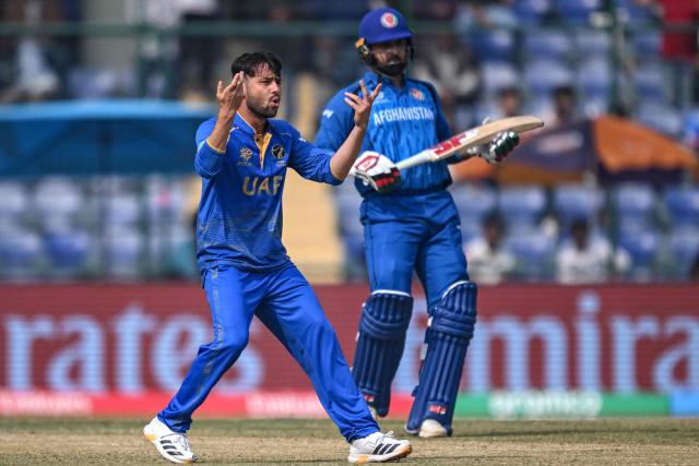UAE's Muhammad Jawadullah (L) reacts after a delivery during the 2026 ICC Men's T20 Cricket World Cup group stage match between Afghanistan and United Arab Emirates at the Arun Jaitley Stadium in New Delhi on February 16, 2026. (Photo by Arun SANKAR / AFP)