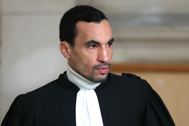 French lawyer of French rapper Nabil Boukhobza aka Naps, Nabil Boudi arrives to attend Naps' trial for sexual assault at the Palais de Justice of Paris, on February 16, 2026. The trial of French rapper Naps, accused of raping a young woman in her sleep in a hotel in 2021, opens on February 16, 2026 before the Paris Criminal Court. Known for his hit song “La Kiffance,” the 40-year-old Marseille native, whose name is Nabil Boukhobza, was also indicted in July 2024 in the Var region for rape and sexual assault following complaints from three young women, charges he also denies. (Photo by Thomas SAMSON / AFP)