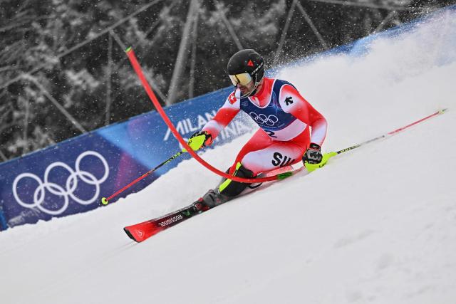 Switzerland's Loic Meillard competes in the first run of the men's slalom alpine skiing event during the Milano Cortina 2026 Winter Olympic Games at the Stelvio Ski Centre in Bormio (Valtellina) on February 16, 2026. (Photo by Fabrice COFFRINI / AFP)